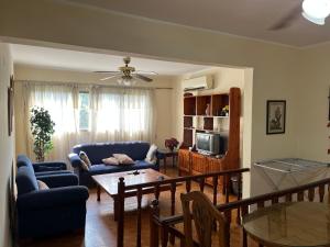 a living room with a blue couch and a table at شقة في المعادي للاجار Maadi Apartement for rent in Cairo