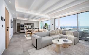 a living room with a couch and a table at Puerto Banus Duplex Lux Selection in Marbella