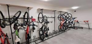 a room with several bikes hanging on a wall at Apartmán Na kraji lesa in Janov nad Nisou