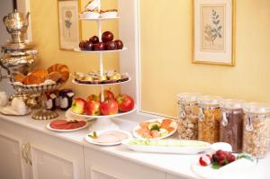 a counter with various plates of food on it at Hanseat-Hotel in Düsseldorf