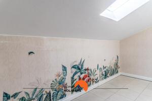 a room with a mural of plants on the wall at #167 Santa Eulália by Home Holidays in Branqueira