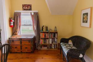 a room with a window and a couch and a book shelf at Wine Country 4 bedrooms in Wellington