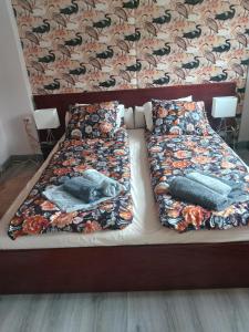 a bed with two pillows on top of it at Apartment Mestwina in Gdynia
