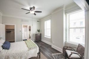 a bedroom with a bed and a ceiling fan at Unique 1 BR 1BA Stay in Downtown - 204 in Champaign