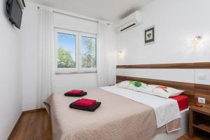 Posteľ alebo postele v izbe v ubytovaní Villa Krnica