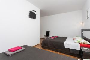 Posteľ alebo postele v izbe v ubytovaní Villa Krnica