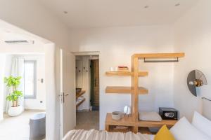 a small apartment with a ladder in a room at Enalios sunset suites in Naxos Chora