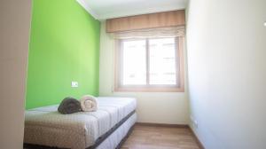 Postel nebo postele na pokoji v ubytování Apartamento en el centro con plaza de garaje