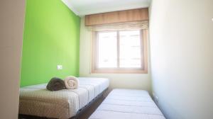 Postel nebo postele na pokoji v ubytování Apartamento en el centro con plaza de garaje