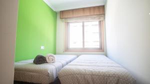 Postel nebo postele na pokoji v ubytování Apartamento en el centro con plaza de garaje