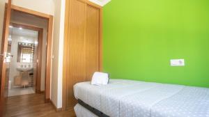 Postel nebo postele na pokoji v ubytování Apartamento en el centro con plaza de garaje
