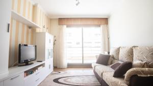 TV a/nebo společenská místnost v ubytování Apartamento en el centro con plaza de garaje