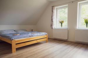Postel nebo postele na pokoji v ubytování Na Kopečku apartmány