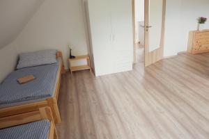 Postel nebo postele na pokoji v ubytování Na Kopečku apartmány