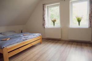 Postel nebo postele na pokoji v ubytování Na Kopečku apartmány