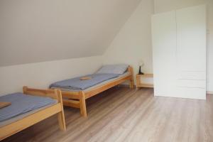 Postel nebo postele na pokoji v ubytování Na Kopečku apartmány
