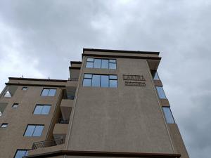 a tall building with a sign on the side of it at Lakira Nita's place in Nairobi