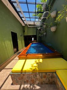a swimming pool in the middle of a building at Hostal Seven Nights Cartagena in Cartagena de Indias