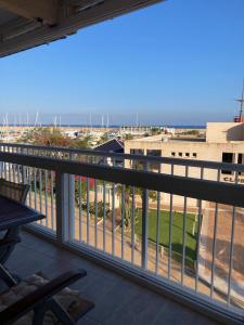 a balcony with a view of the beach at APARTAMENTO PUERTO PLAYA in Villajoyosa