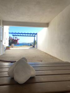 a white sculpture sitting on the floor of a building at Yellow Beach House in Logaras