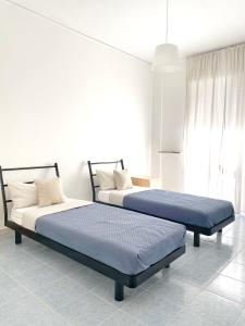 Cama o camas de una habitación en NERI Rooms