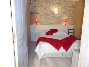 Katil atau katil-katil dalam bilik di Gîte haut de gamme dans un mas provençal