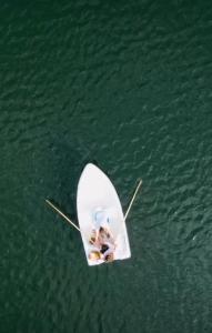 a couple of people in a boat in the water at Zielona Górka in Biskupiec