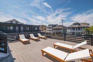 a group of lounge chairs on a roof at The Surf Club in Ocean City
