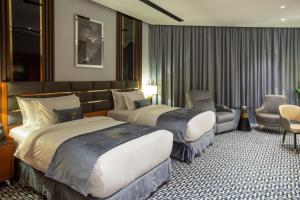 Postel nebo postele na pokoji v ubytování STwin Hotel