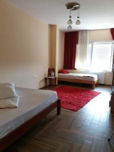 En eller flere senge i et værelse på Villa Guci