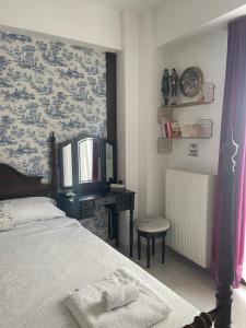 Ένα ή περισσότερα κρεβάτια σε δωμάτιο στο 4lions Studio check -in after 16:00