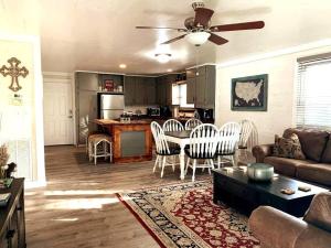 a living room with a couch and a table at Mae’s Cottage in the Clouds in Blue Ridge