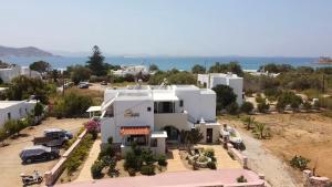 an aerial view of a white house with a parking lot at Sunshine in Naxos Chora