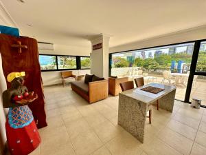 a living room with a view of a living room at Ondina Apart Hotel Residences in Salvador