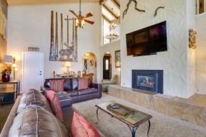 a living room with a couch and a fireplace at Dillon Vacation Rental Hot Tub and Beautiful Views! in Dillon