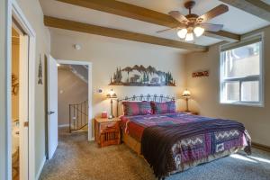 a bedroom with a bed and a ceiling fan at Dillon Vacation Rental Hot Tub and Beautiful Views! in Dillon