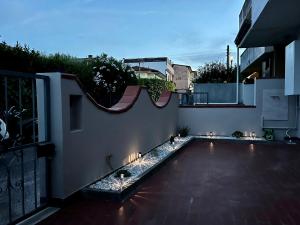 an outdoor patio with lights on a building at Appartamento Sunflower in Viareggio