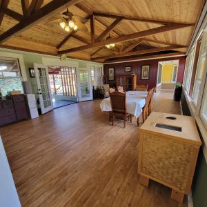 a kitchen and dining room with a table and chairs at Kohala Village INN in Hawi