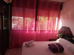A bed or beds in a room at Hostal New York City