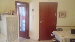 a room with a door and a room with a table at Costa Portil - Arroyo de la Plata 5 in El Portil