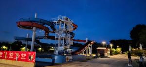 a water slide in a park at night at Apartment Laguna 70 in Izola