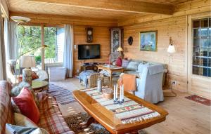 a living room with a couch and a table at Beautiful Home In Frde With House A Panoramic View in Førde