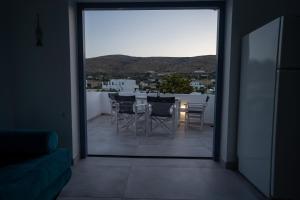 a view of a balcony with a table and chairs at Traditional White House2 in Dhragoulás