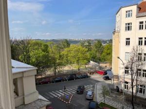 a view of a parking lot from a building at Mama's apartment in Letna in Prague
