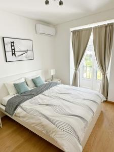 Postel nebo postele na pokoji v ubytování Liberty 140 Deluxe Apartment