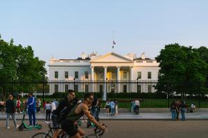 a group of people riding bikes in front of the white house at Sonder The Quincy in Washington, D.C.