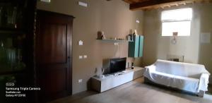 A bed or beds in a room at Appartamento il castellare