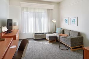 a living room with a couch and a chair at TownePlace Suites by Marriott Newnan in Newnan