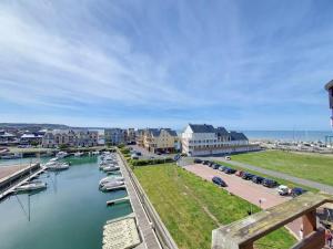 a view of a harbor with boats in the water at Deauville, Superbe F4 - Marina - double expo vue mer rare ! in Deauville