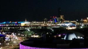 a view of a city at night with lights at 1 комн квартира Тауельсиздик 34-2 18 этаж ЖК Silk Way in Promyshlennyy